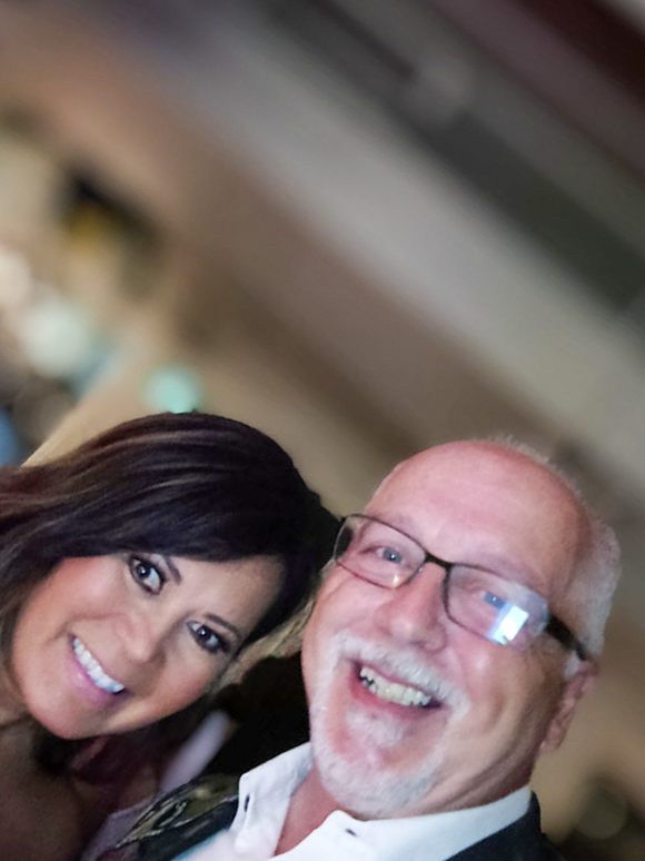 Two guests smiling together at a Toronto event