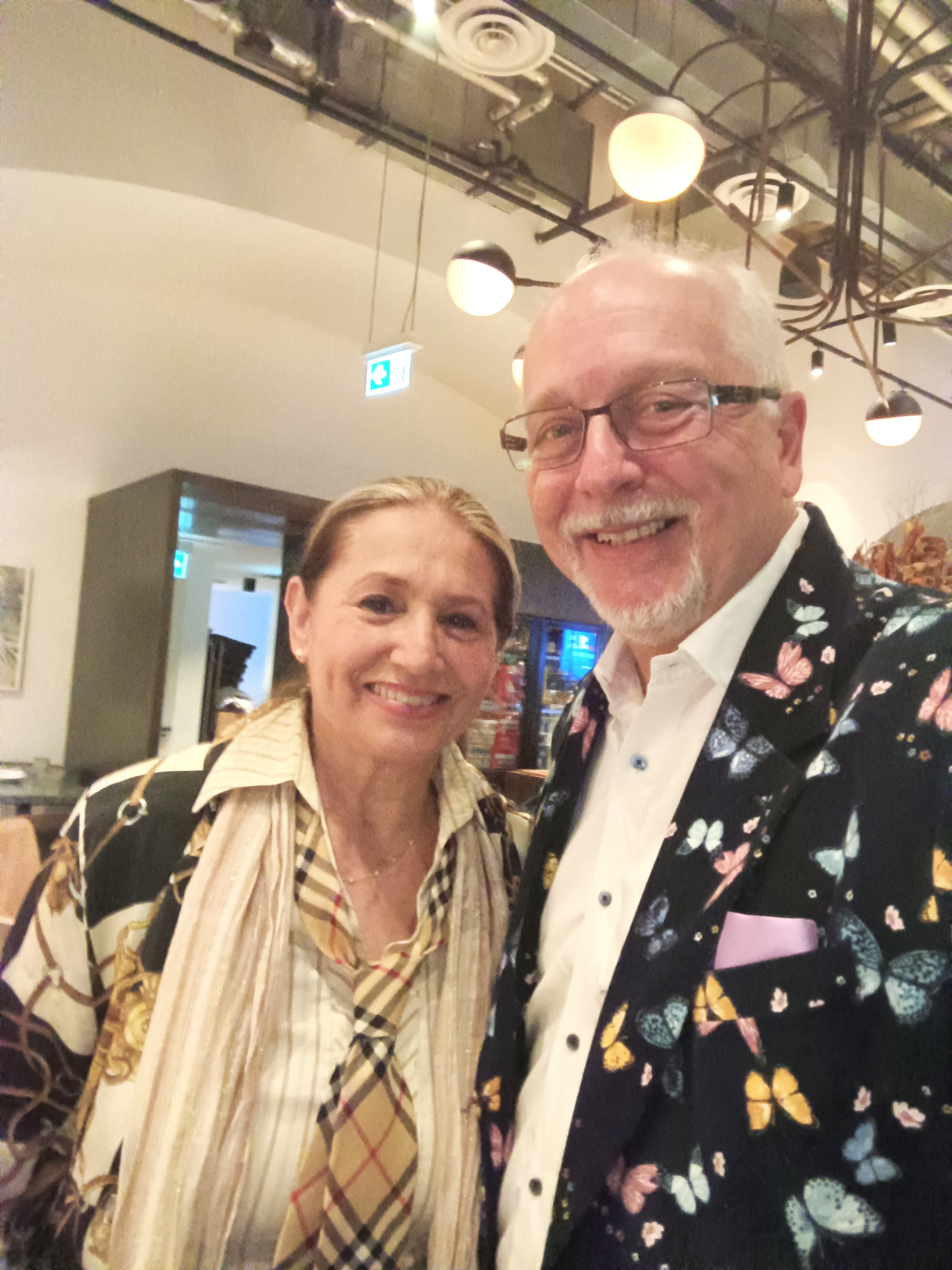Two guests at an evening gathering