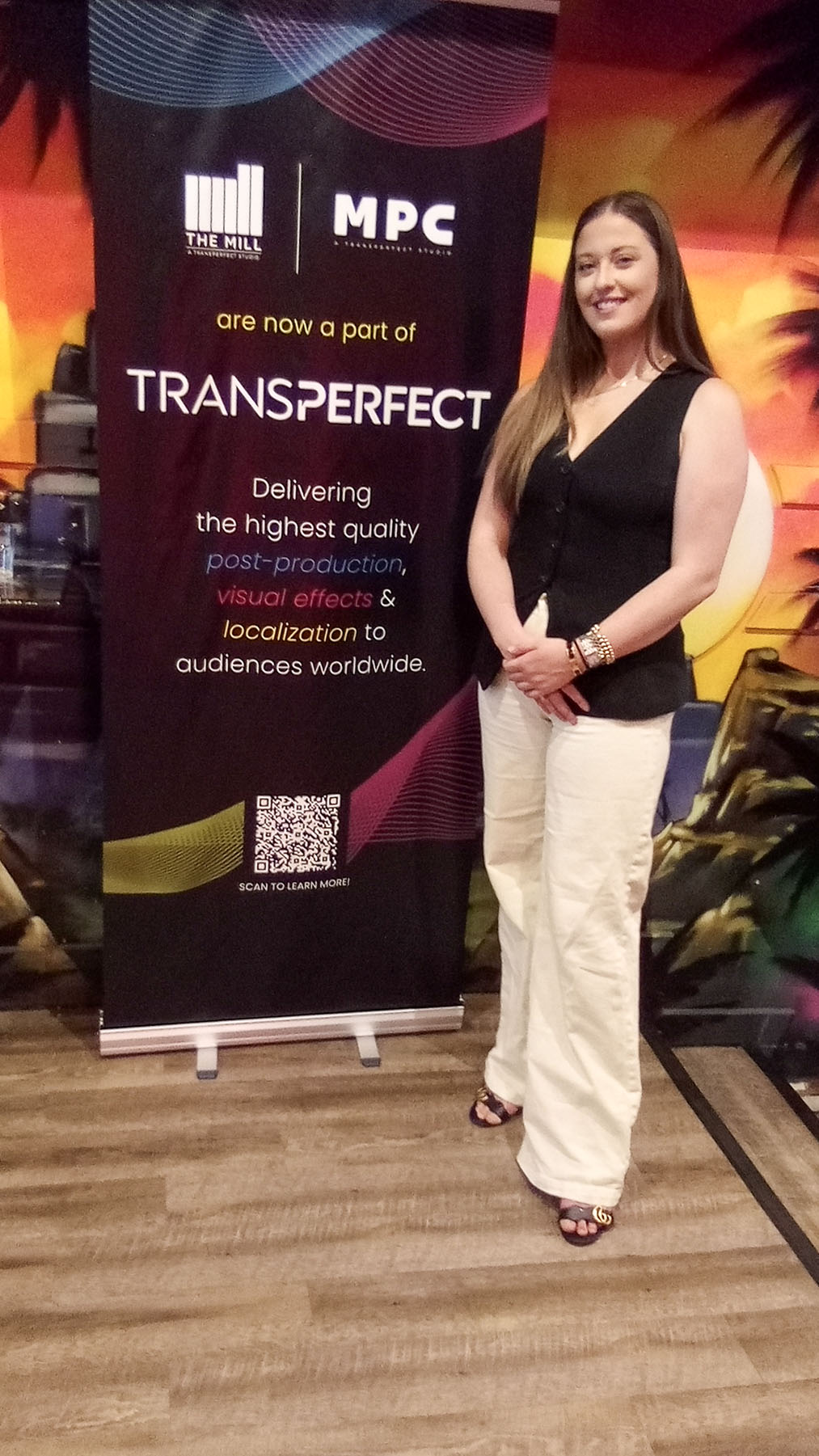 Guest beside an event partner display
