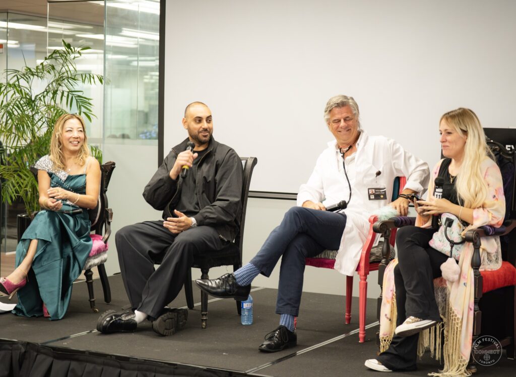 The four Panel 2 participants share a smiling moment during the onstage conversation. AI & Film Forum, Panel 2, September 14, 2026.