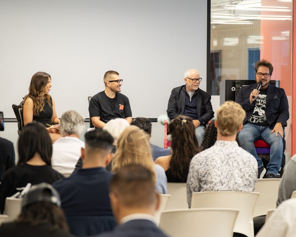 Audience members face the four Panel 3 participants as a speaker on the right addresses the room. AI & Film Forum, Panel 3, September 14, 2026.